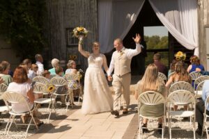Wedding guests enjoying an outdoor, garden wedding ceremony at a beautiful wedding venue near Ann Arbor