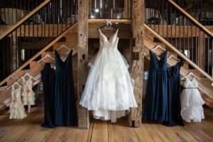 Wedding dress, bridesmaid dresses and flower girl dresses displayed at a garden wedding venue near Ann Arbor