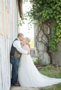 Bride and groom kissing at an all inclusive wedding venue near Ann Arbor