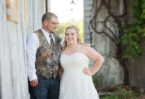 Bride & Groom pose for wedding day photos at their garden wedding venue near Ann Arbor