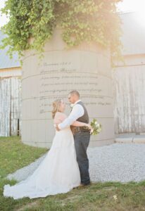 Bride & groom posing for wedding day photos at their Irish Hills wedding venue near Ann Arbor Michigan