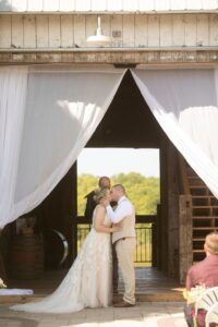 Bride & groom grand entrance into their wedding reception at a barn wedding venue near Ann Arbor